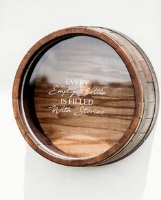 a wooden barrel with the words every empty bottle is filled with success written on it