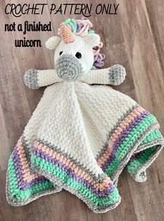 a crochet unicorn blanket is laying on the floor with text overlay that reads, crochet pattern only not a finished unicorn