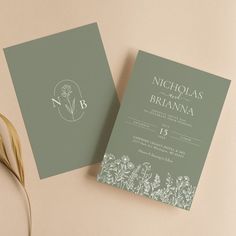 two wedding cards on top of each other next to a flower vase with a plant in it