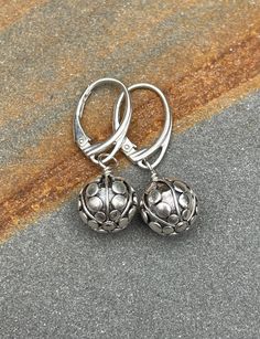 Sterling silver leverback Earrings. The Bali sterling silver earrings are handmade. The beads have a pattern of lines and dots they are 10 mm wide. The earrings are 1 3/16 inches (3.0 cm) in length. Choose earring wires from the drop-down menu. The pictures are enlarged to show detail. The earrings ship in a small organza bag inside a gift box, ready to give... or keep! To see more WireAndPearl sterling silver earrings, please visit: https://www.etsy.com/shop/WireAndPearl?section_id=18630564 Als Silver Drop Earrings With Lever Back, Silver Round Earrings With Lever Back, Adjustable Silver Jewelry With Lever Back, Silver Earrings With Lever Back Ear Wires For Gifts, Silver Round Lever Back Earrings, Silver Lever Back Jewelry Gift, Silver Lever Back Jewelry As Gift, Round Silver Lever Back Earrings, Silver Lever Back Jewelry For Gift