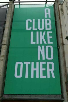 a green sign that says a club like no other