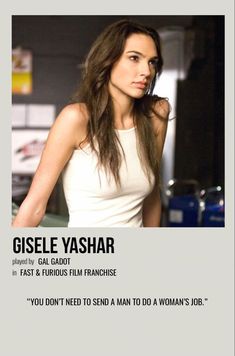 a woman with long hair standing in front of a sign that says gisel yashar