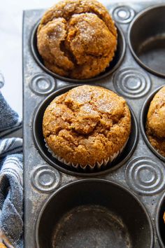 several muffins are sitting in a cupcake tin