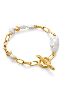 Powney's love of natural imperfections shines through this chain bracelet that's stationed with baroque imitation pearls. Exclusive US retailer 7 1/2" length Pearl size ranges from 5mm to 7mm x 18mm Toggle closure Sterling silver/18k-gold plate/keshi pearl Imported Luxury Pearl Bracelet With Pearl Drop, Luxury Gold Akoya Pearl Bracelet, Luxury Yellow Gold Akoya Pearl Bracelet, Classic Baroque Pearl Bracelets With Oyster Clasp, Luxury Baroque Pearl Bracelet With Pearl Charm, Keshi Pearl Bracelet, 14k Gold-filled Pearl Charm Bracelet, Pearl Bracelet Gold, Monica Vinader