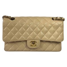 Chanel Timeless Classic Flap Medium Beige Caviar Leather Gold Hardware, 2009-2010 This one-of-a-kind Chanel Classic Flap Vintage bag exudes sophistication and timeless elegance. Crafted from luxurious beige caviar leather. CONDITION: VERY GOOD This preloved authentic Chanel bag is in very good condition with light stains all over the bag. Light crease on the leather, scratches to the hardware. DETAILS Circa 2009-2010 Series 13xxxxxx Chanel Timeless/ Classic Flap Caviar leather Double flap Beige Dior New Look, Birth Card, Convertible Tote Bag, Vintage Chanel Bag, Chanel Brand, Beige Interior, Vintage Bag, Bag Light, Vintage Chanel