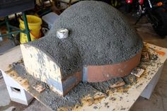 a large mound of cement sitting on top of a table