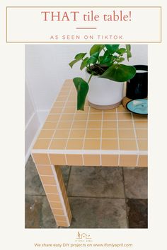 a small table with a plant on top and the words that tile table as seen on tiktok