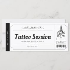 a tattoo session ticket sitting on top of a table