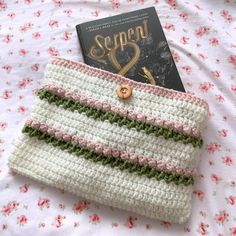 crochet book sleeve 🌷🤍

• button closure
• 10 1/2 inches length x 7 1/2 inches width
•can also hold tablets/everyday items!

#coquette #crochet #handmade #cute Aesthetic Crochet Book Cover, Crochet Macbook Cover, Crochet Book Sleeve, Coquette Crochet, Crochet Book Cover, Macbook Covers, Crochet Book, Book Sleeve, Crochet Books