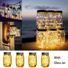 four mason jars with fairy lights in them on the wall and next to each other