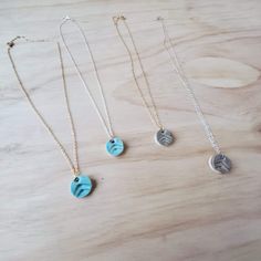 "These adjustable 16\"-18\" necklaces have 1/2\"x 1/4\" charms, which are a dainty-yet-noticeable addition to any outfit. Each charm is handmade and stamped with an upward print,  fired, then coated with glaze on one side and refired. The backside of the charm is left unglazed, open-surface for diffusing essential oils (or perfumes). The ceramic bead becomes warm as you wear it, and in turn, the aroma of the oil will be released. One drop of my favorite essential oil (Stress Away) on the back an Adjustable Friendship Pendant Necklace, Adjustable Pendant Necklace For Friendship, Adjustable Round Charm Necklace Nickel Free, Adjustable Nickel-free Round Charm Necklace, Nickel-free Round Pendant Necklaces For Friendship, Minimalist Charm Necklace Adjustable Length For Gift, Dainty Nickel-free Necklaces For Friendship, Nickel Free Round Pendant Necklaces For Friendship, Tiny Adjustable Charm Necklaces As Gift