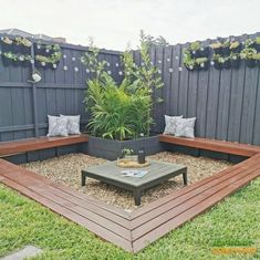 a wooden bench sitting in the middle of a garden