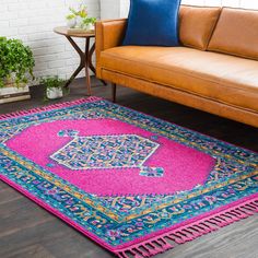 a living room area with a couch and rug