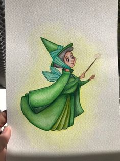 a drawing of a wizard holding a wand in her hand and wearing a green outfit