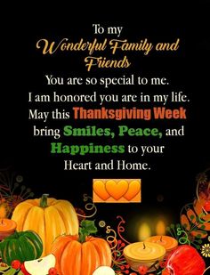 a thanksgiving greeting with pumpkins and candles