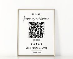 a qr code is on the wall next to a framed poster that says please, wait us at your business name