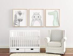 a baby's room with three pictures on the wall