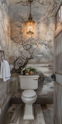 a bathroom with a white toilet sitting under a light fixture