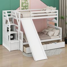 a white bunk bed with a slide next to it