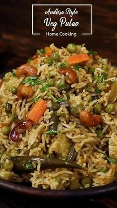 a bowl filled with rice and vegetables on top of a table