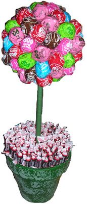 a flower pot filled with candy covered candies and lollipops in the shape of a tree