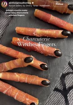 an advertisement for charlotte witches fingers on a black surface with other food items in the background