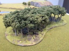 a model of a forest with trees in the foreground