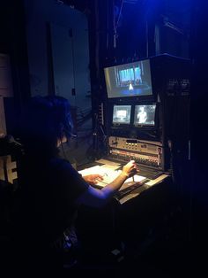 a person sitting in front of a computer screen