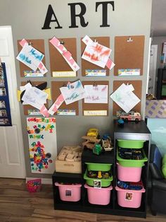 the wall is decorated with lots of different colored bins and papers on it's sides