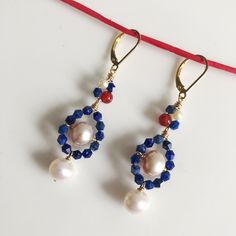 Unique Pearl Earrings with Lapis and Carnelian, wrapped in 14/20 gold filled wire. These pearls have a beautiful luster. They are untreated Freshwater pearls, they are not dyed.  The Lapis is natural(not dyed), the Carnelian is natural(not dyed) The lever back ear wire makes it easy to put them on and keeps them safe on your ear while you wear them. Elegant Round Beaded Earrings With Natural Stones, Elegant Oval Beaded Earrings As Gift, Elegant Oval Beaded Earrings, Elegant Oval Beaded Earrings For Gift, Elegant Beaded Earrings With Natural Stones For Gift, Women Gold Jewelry, Unique Pearl Earrings, Jewelry Making Earrings, Making Earrings