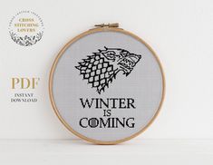 a cross stitch pattern with the words winter is coming in black and white on it