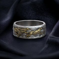 Embrace the wild spirit of the wolf with this Wolf Ring Running Wolves Wedding Band, meticulously crafted from 925 sterling silver. This striking ring features a dynamic design of running wolves, symbolizing freedom, unity, and the untamed beauty of nature. Perfect for both men and women, this adjustable band offers a comfortable fit, making it an ideal choice for nature lovers and those who resonate with the power and grace of wolves. The intricate craftsmanship captures the lifelike movement o Wolf Ring, Viking Ring, Masonic Ring, Retro Ring, Animal Rings, Cross Ring, Everyday Rings, Nature Inspired Jewelry, Gifts For Brother