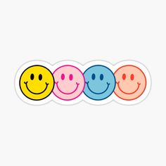 three smiley face stickers with different colors and shapes on the same side, one is smiling