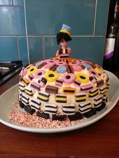 a decorated cake sitting on top of a white plate