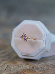 A 0.34 ct purplish pink sapphire from Sri Lanka, heated with small reddish inclusions and silk, exudes enchantment. Paired with six tiny pink sapphires from Madagascar, designed to complement the mystical vibe of the ring. Each piece of our jewelry is handcrafted with love. Barbie Ring, Heirloom Rings, Luxury Engagement Rings, September Birthstone Rings, Topaz Necklace, Pink Sapphire Ring, Engagement Ring Box, Great Wedding Gifts, Wedding Ring Box