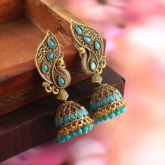 Overview These stylish Jhumki Earrings set from JewelryTrack will certainly leave you spellbound. These Jhumki Earrings set have an excellent finish and gives out an exquisite sense of style. If you are looking for an amazing Fashion Jewelry set for special occasions such as Anniversary, Engagement, Party, Wedding or for gifting , then your search ends here. Item Description: The look is stunning and preciously suitable for all kinds of dressy occasions. Metal: Brass OCCASION: PARTY WEAR , WEDDI Oxidized Jhumkas, Dressy Casual Outfits, Jhumki Earrings, Amazing Fashion, Peacock Design, Fashion Jewelry Sets, Jewelry Women, Turquoise Color, Blue Beads