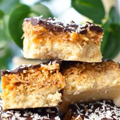 four pieces of coconut bars stacked on top of each other