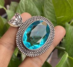 ♥ The most unique jewelry you can find, a perfect gift for you and your loved one ♥ * PRODUCT INFORMATION ● Gemstone: Blue Topaz ● Pendant Length : 5.9 Cm ● Metal : Sterling Silver ● Plating: 925 parts per 1000 ● Stone Shape : Same As Picture ● Stone Category : Cabochons ● Silver Polish : High ❏ Care instructions 1-: Put Jewelry On After Applying Makeup 2-: Don't Wear Jewelry In Swimming Pools And 3-: Contact Sports and Jewelry Don't Mix 4-: Remove Your Jewelry Before Bathing 5-: Use Jewelry Polishing Cloths for Best Results 6-: Use Warm Water to Clean Jewelry 7-: Inspect Your Jewelry Regularly8-: When Traveling with Jewelry, Use a Case * Benefits Of Wearing Silver As a metal, silver has significant health benefits that have been used across cultures for centuries. Silver has a proven trac Spiritual Blue Topaz Jewelry In Blue, Sapphire Gemstones With Accents For Gifts, Sapphire Gemstones For Gift, Spiritual Blue Topaz Jewelry As A Gift, Aquamarine Pendant Jewelry For Gifts, Aquamarine Round Pendant Jewelry For Gift, Silver Blue Topaz Oval Pendant Jewelry, Aquamarine Pendant Jewelry As A Gift, Silver Oval Blue Topaz Pendant Jewelry