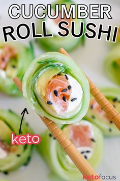 Chopsticks holding a cucumber wrapped sushi roll with salmon and cream cheese inside. Seaweed Veggie Wraps, Stuffed Cucumber Sushi, Low Carb California Roll, Rice Free Sushi, Cucumber Sushi Rolls Low Carb, Sushi Recipes Without Seaweed, Low Carb Sushi Wraps, Low Carb Sushi Rolls