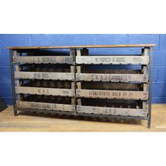 an old wooden crate with two rows of crates on the bottom and one shelf below it