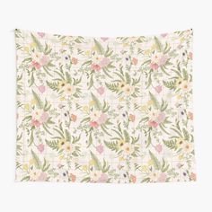 a wall hanging with flowers and leaves on the front, in pastel pink tones