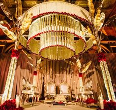 an elaborately decorated room with chandeliers and flowers on the floor in front of it