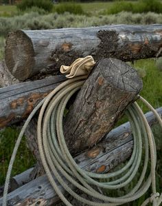 a rope is tied to a wooden fence