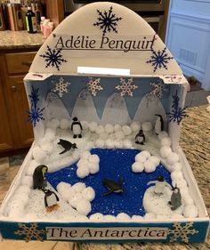 an open box with penguins and snowflakes on it