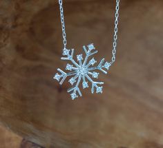 "Sterling silver snowflake necklace is so stunning and so elegant. Snowflake jewelry can be matched easily with most of the dresses for special days especially for night outs. Dainty snowflake necklace would be a great charm necklace accessory for the Holidays Season especially for Christmas. Snowflake jewelry would be a perfect gift idea for hard-to-buy-for people. We are %100 sure that person who wears will feel like a princess with this necklace because it is so unique and you don't want to g Snowflake Dress, Graduation Gifts For Friends, Snowflake Jewelry, Winter Necklace, Elegant Snowflake, Womens Silver Jewelry, Pretty Jewelry Necklaces, Snowflake Necklace, Winter Jewelry