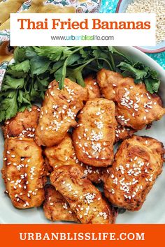 a plate full of fried bananas with sesame seeds and parsley on the side text reads, thai fried bananas