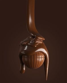 the chocolate sculpture is shaped like an elephant's head and has long, slender legs