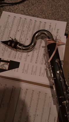 an instrument laying on top of sheet music