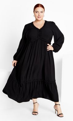 Your style for the next memorable occasion is fabulously sorted with the Gaia Dress. Featuring a ruffled V-neckline, long sleeves and a tiered relaxed skirt, this dress flows gracefully over your curves in the best way. Key Features Include: - Ruffled V neckline - Long sleeves with elastic cuff - Ruffled waistline - Pull over style - Long tiered relaxed skirt Add a bold touch with strappy red pumps. | Plus Size Dress Gaia in Black, Size 14/XS | City Chic Oversized Long Sleeve Black Maxi Dress, Black Nursing-friendly Maternity Dress, Lingerie Dress, Date Night Dresses, Casual Summer Dresses, City Chic, Fit N Flare Dress, Plus Size Dress, Comfortable Fashion