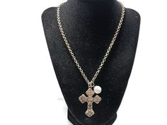 This cross necklace is 18 inches long and it has a 2-inch adjustment chain for added length. The cross measures 1.5 inches wide by 2 inches long. There are also white faux pearl and rhinestone charms. Silver Cross Necklace With Pearl Chain, Silver Cross Pendant Necklace With Pearl Chain, Adjustable Metal Cross Necklace, Beaded Boho Necklace, Crystal Necklace Pendant, Leather Tassel, Lariat Necklace, Rhinestone Necklace, Gold Leather